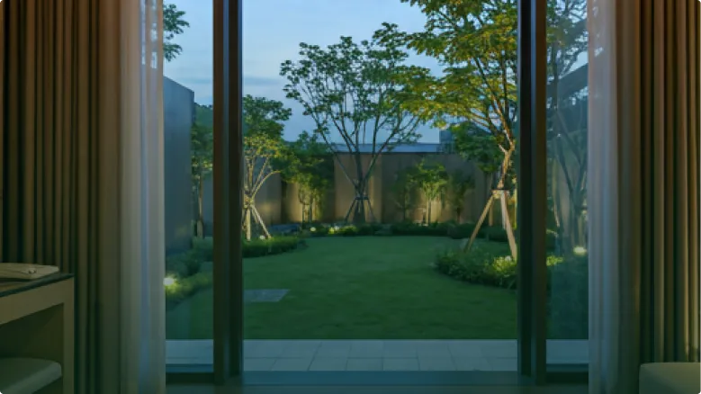 Modern suite opening to a lush courtyard